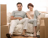 couple on couch, furniture removals, household movers, door-to-door, pack-your-own